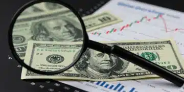 Fed's 0.25% Rate Hike: Impact on US Borrowers from Jan 2025 Magnifying glass over dollar bill with rising interest rate graph, symbolizing Fed's 0.25% rate hike impact on US borrowers.