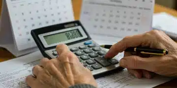 Elderly hands calculating Social Security benefits, 2026 COLA impact